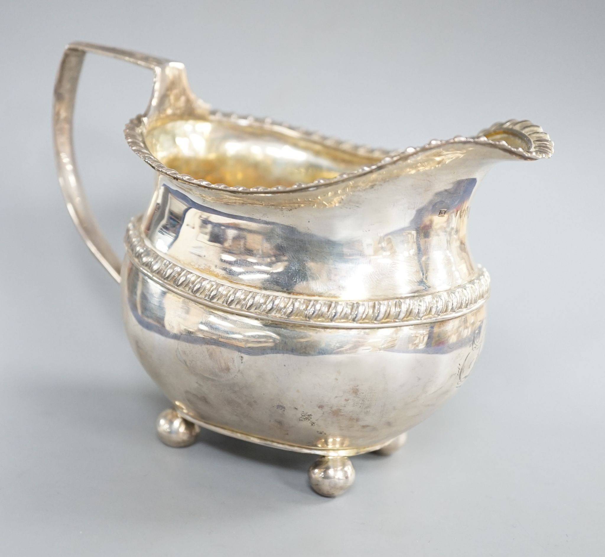 A late George III silver cream jug, J.S?, London, 1817, 10.2cm, 6.5oz.